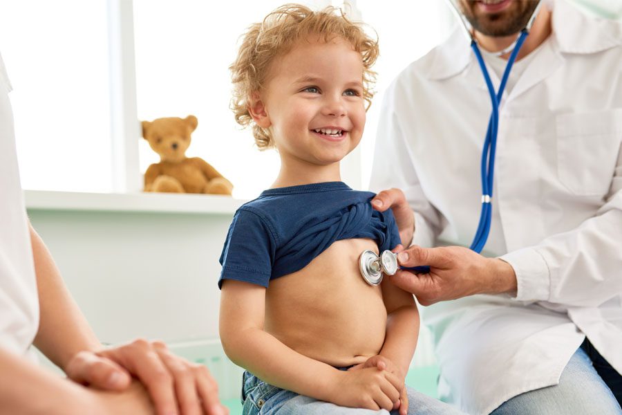 Individual Health Insurance - Child with the Doctor an a Well Visit Appointment